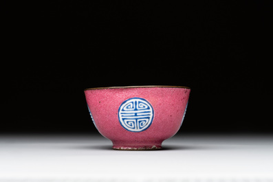 A rare Chinese Canton enamel ruby-ground 'Bats and Shou' cup on stand, Qianlong mark and of the period