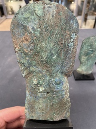 Four Chinese and Vietnamese bronze axes and an arrowhead, Western Zhou/Dong Son