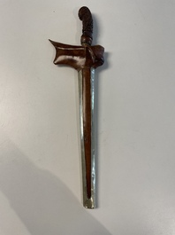 A collection of six krises with carved handles, four with scabbard, Indonesia, 19th C.