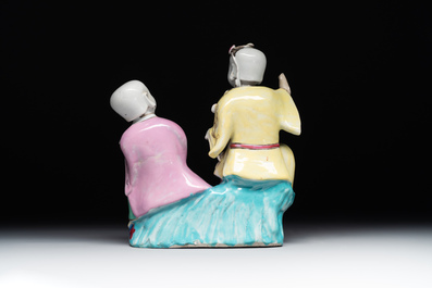 A Chinese famille rose 'Hehe Erxian' group on a wooden stand, Qianlong