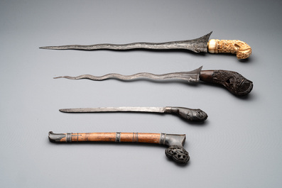 A collection of six krises with carved handles, four with scabbard, Indonesia, 19th C.