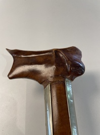A collection of six krises with carved handles, four with scabbard, Indonesia, 19th C.