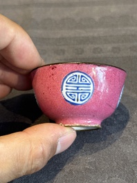 A rare Chinese Canton enamel ruby-ground 'Bats and Shou' cup on stand, Qianlong mark and of the period