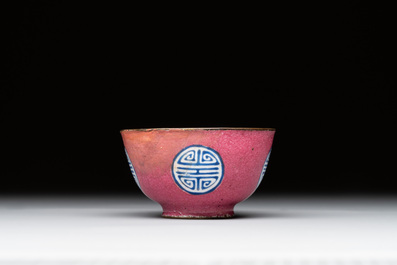 A rare Chinese Canton enamel ruby-ground 'Bats and Shou' cup on stand, Qianlong mark and of the period