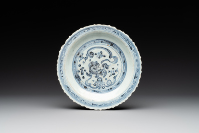 A Chinese blue and white 'phoenix' dish and two 'Buddhist lion' and 'peony' plates, Hongzhi/Zhengde