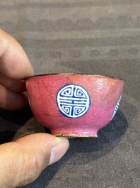 A rare Chinese Canton enamel ruby-ground 'Bats and Shou' cup on stand, Qianlong mark and of the period