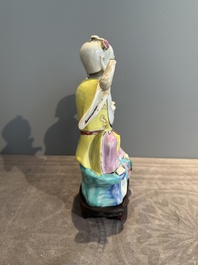 A Chinese famille rose 'Hehe Erxian' group on a wooden stand, Qianlong