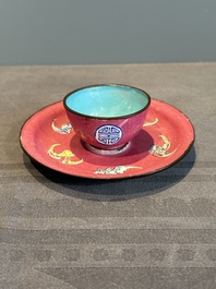 A rare Chinese Canton enamel ruby-ground 'Bats and Shou' cup on stand, Qianlong mark and of the period