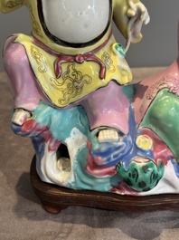 A Chinese famille rose 'Hehe Erxian' group on a wooden stand, Qianlong