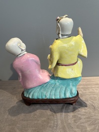 A Chinese famille rose 'Hehe Erxian' group on a wooden stand, Qianlong