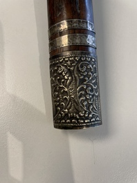 A collection of six krises with carved handles, four with scabbard, Indonesia, 19th C.