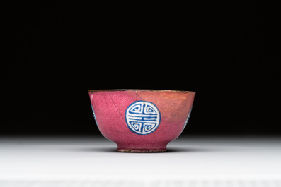 A rare Chinese Canton enamel ruby-ground 'Bats and Shou' cup on stand, Qianlong mark and of the period