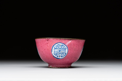 A rare Chinese Canton enamel ruby-ground 'Bats and Shou' cup on stand, Qianlong mark and of the period