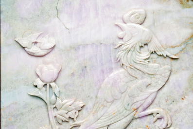 A Chinese lavender and green jadeite 'phoenix' plaque in a hongmu frame, early 20th C.