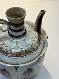 An Annamese or Vietnamese brown-glazed cream-ground 'lotus' ewer, 14th C.