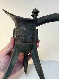 A Chinese archaic bronze wine vessel with taotie design, 'jue 爵', Zhou