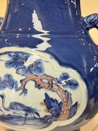 A Chinese blue, white and copper-red powder-blue-ground 'hu' vase, Qianlong