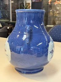 A Chinese blue, white and copper-red powder-blue-ground 'hu' vase, Qianlong