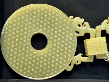 An imperial Chinese yellow jade 'dragon and phoenix' twin 'bi' disc, Qing