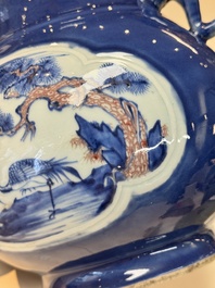 A Chinese blue, white and copper-red powder-blue-ground 'hu' vase, Qianlong