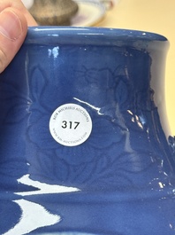 A Chinese blue, white and copper-red powder-blue-ground 'hu' vase, Qianlong