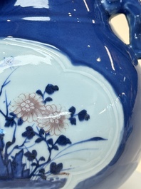 A Chinese blue, white and copper-red powder-blue-ground 'hu' vase, Qianlong