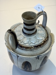 An Annamese or Vietnamese brown-glazed cream-ground 'lotus' ewer, 14th C.