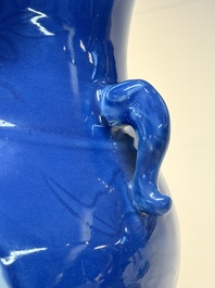 A Chinese blue, white and copper-red powder-blue-ground 'hu' vase, Qianlong