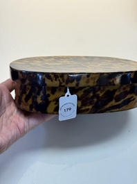 A fine and rare Chinese tortoiseshell-veneered and red-lacquered oval box and cover, signed Wang Wenzhi 王文治, Qianlong mark and of the period