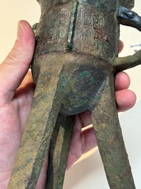 A Chinese archaic bronze wine vessel with taotie design, 'jue 爵', Zhou