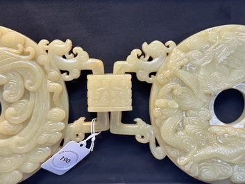 An imperial Chinese yellow jade 'dragon and phoenix' twin 'bi' disc, Qing