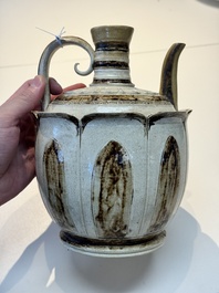 An Annamese or Vietnamese brown-glazed cream-ground 'lotus' ewer, 14th C.