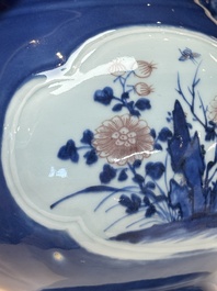 A Chinese blue, white and copper-red powder-blue-ground 'hu' vase, Qianlong