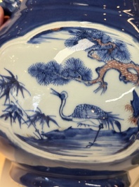 A Chinese blue, white and copper-red powder-blue-ground 'hu' vase, Qianlong