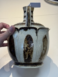 An Annamese or Vietnamese brown-glazed cream-ground 'lotus' ewer, 14th C.