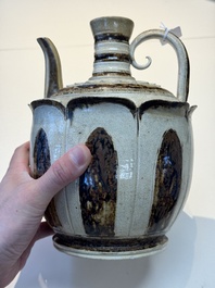 An Annamese or Vietnamese brown-glazed cream-ground 'lotus' ewer, 14th C.