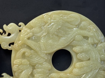An imperial Chinese yellow jade 'dragon and phoenix' twin 'bi' disc, Qing