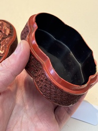 A fine Chinese red cinnabar lacquer ruyi-form 'Ba Man Xian Bao 八蠻獻寶' box and cover, Qianlong
