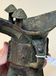 A Chinese archaic bronze wine vessel with taotie design, 'jue 爵', Zhou
