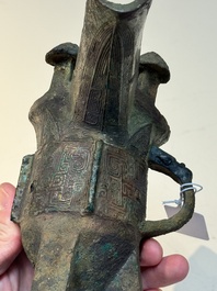A Chinese archaic bronze wine vessel with taotie design, 'jue 爵', Zhou