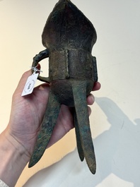 A Chinese archaic bronze wine vessel with taotie design, 'jue 爵', Zhou