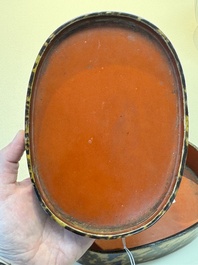A fine and rare Chinese tortoiseshell-veneered and red-lacquered oval box and cover, signed Wang Wenzhi 王文治, Qianlong mark and of the period