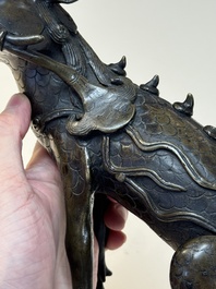 A fine Chinese bronze incense holder in the form of a qilin, Ming