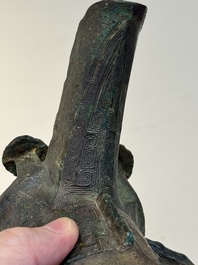 A Chinese archaic bronze wine vessel with taotie design, 'jue 爵', Zhou