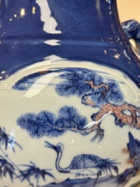 A Chinese blue, white and copper-red powder-blue-ground 'hu' vase, Qianlong