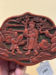 A fine Chinese red cinnabar lacquer ruyi-form 'Ba Man Xian Bao 八蠻獻寶' box and cover, Qianlong