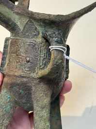 A Chinese archaic bronze wine vessel with taotie design, 'jue 爵', Zhou