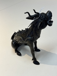 A fine Chinese bronze incense holder in the form of a qilin, Ming