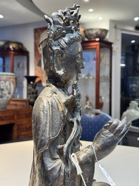 A large Chinese bronze Bodhisattva on wooden stand, Ming