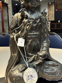 A large Chinese bronze Bodhisattva on wooden stand, Ming